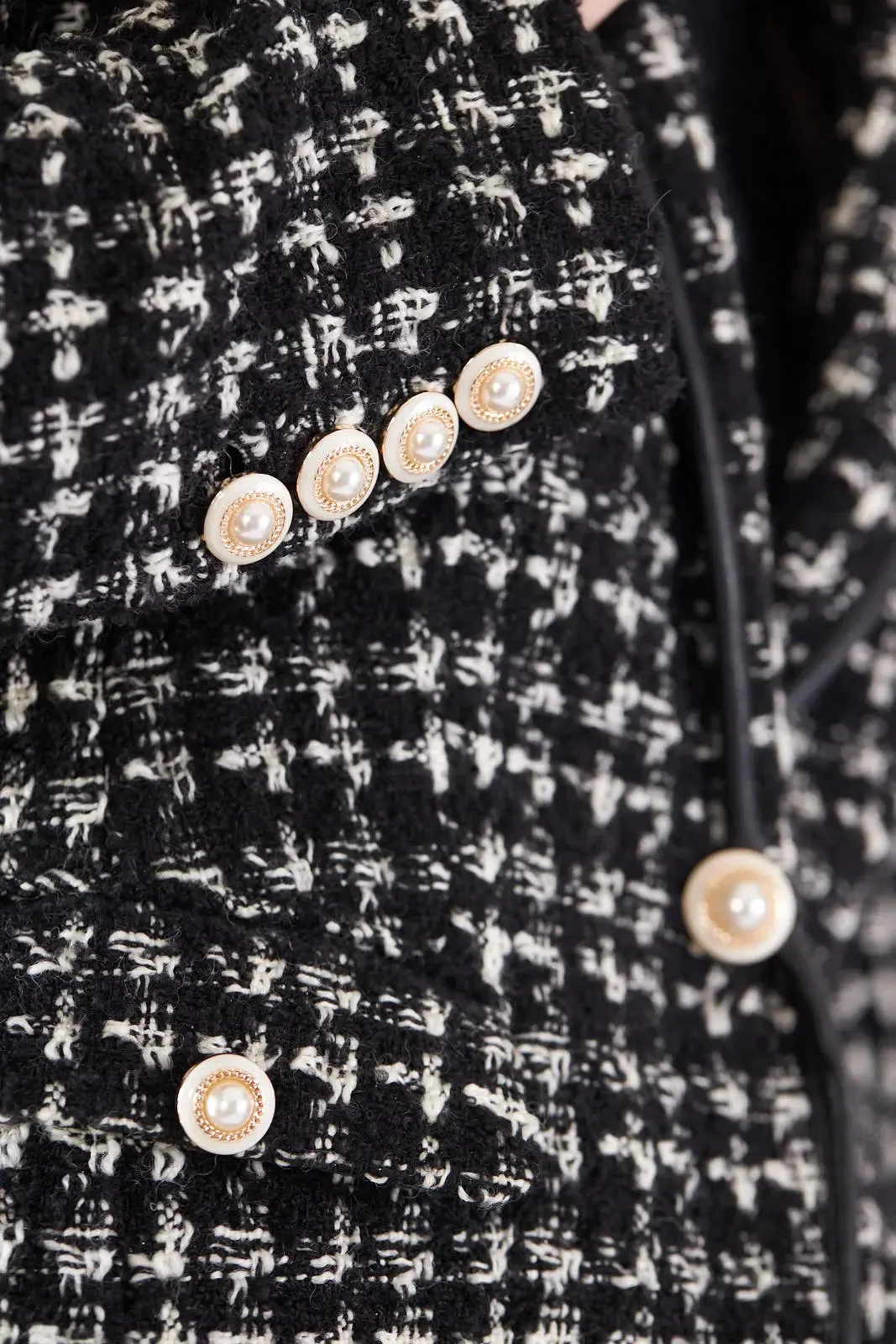 Sophisticated Black and White Tweed Blazer with Luxurious Pearl Details